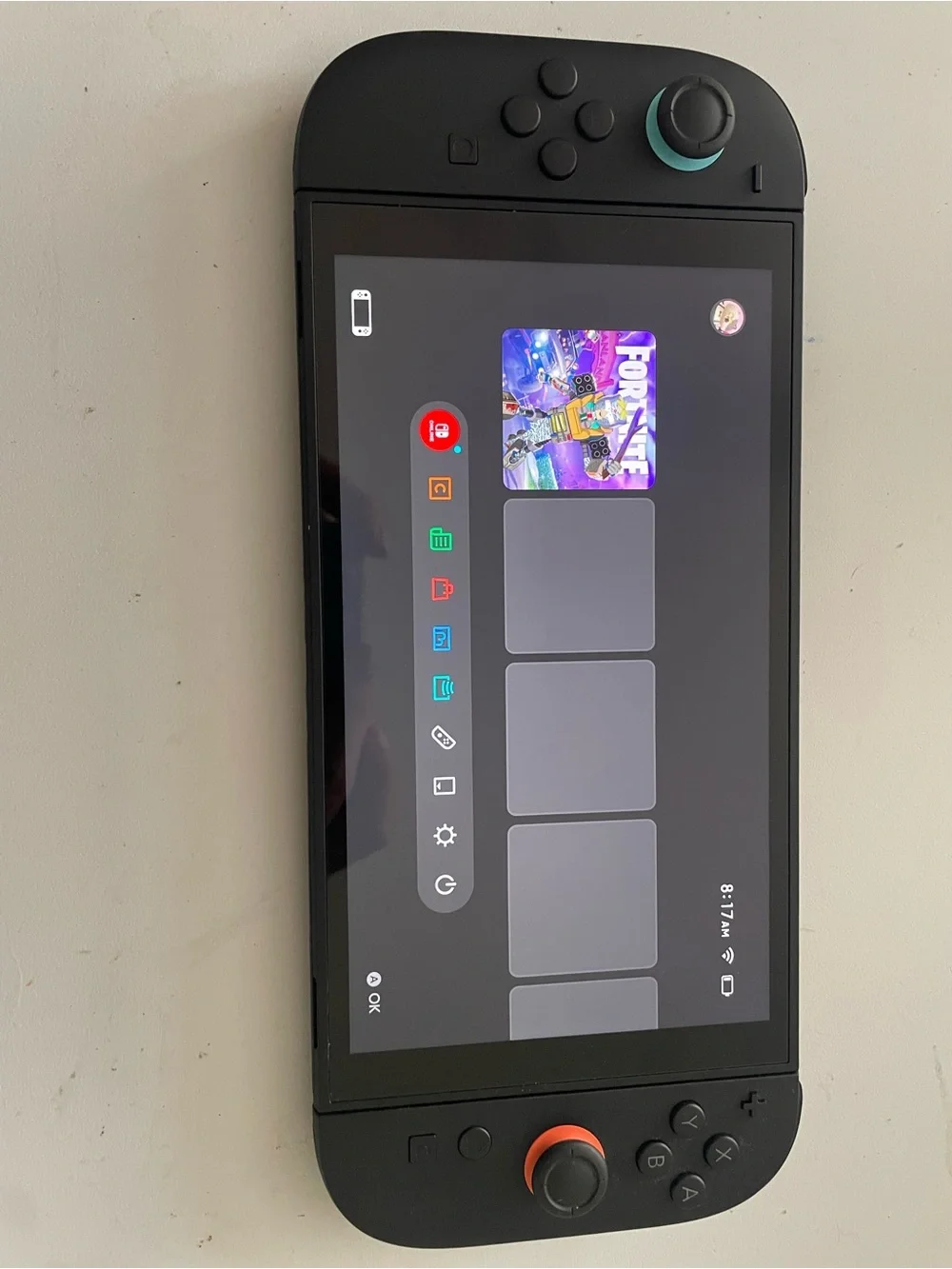 Nintendo Switch Handheld Console Black with Blue and Orange Accent Rings